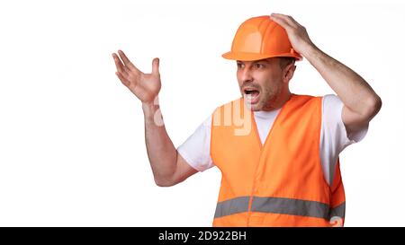 Angry Construction Worker Shouting Looking Aside Over White Background, Panorama Stock Photo