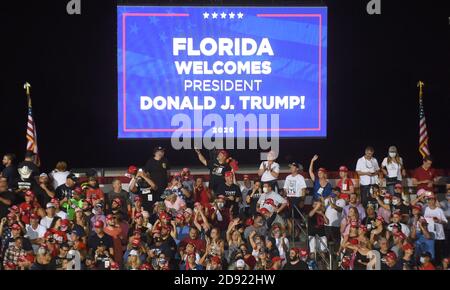 Opa Locka, United States. 01st Nov, 2020. November 1, 2020 - Opa-Locka, Florida, United States - People wait for the arrival of U.S. President Donald Trump at a campaign rally at Miami-Opa Locka Executive Airport on November 1, 2020 in Opa-Locka, Florida. President Trump held events in five states today, as he continues his campaign against Democratic presidential nominee Joe Biden two days before the November 3 election. Credit: Paul Hennessy/Alamy Live News Stock Photo