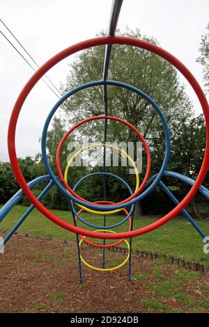 Multi-coloured climbing hoops in an empty children's playground Stock Photo