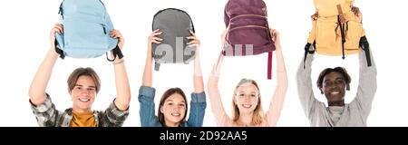 Panoramic shot of smiling multiethnic teenagers holding backpacks isolated on white Stock Photo