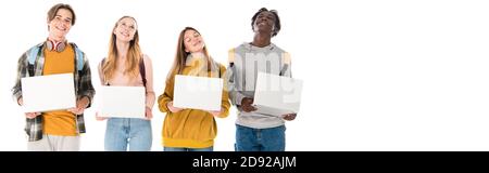 Panoramic crop of positive multicultural teenagers holding laptops isolated on white Stock Photo