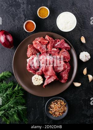 fresh pork meat with spices and vegetables Stock Photo