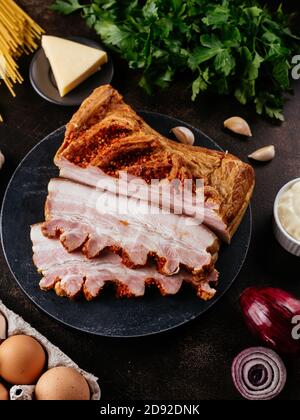 ham sliced on a background with vegetables and spices Stock Photo