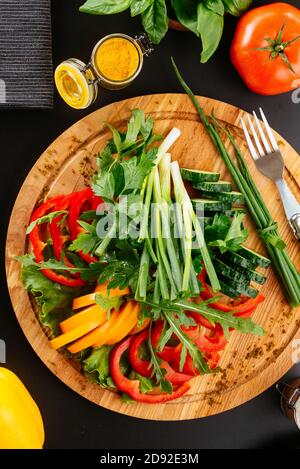 a variety of vegetables cut  on wooden plate Stock Photo