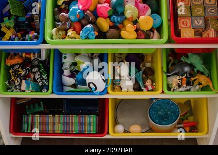toy storage bins overflowing with toys Stock Photo