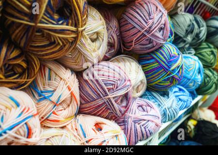view of various color tangles of wool yarn for knitting, selective focus. Stock Photo
