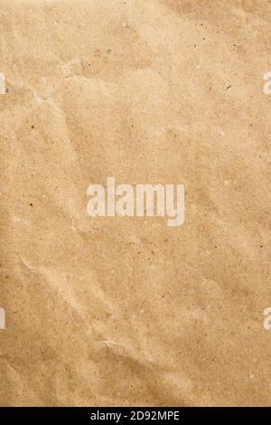 Close-up of craft paper. Vertical view of an empty brown cardboard blank, copy space for text Stock Photo