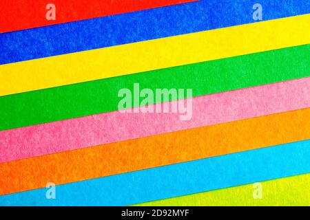 multicolored stripes at an angle from paperboard, abstract background, top view Stock Photo