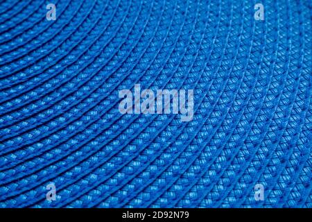 A part of blue round woven textile mat. Abstract background, selective focus Stock Photo