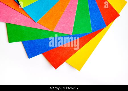 Many various colorful sheets of cardboard on a white background, top view Stock Photo