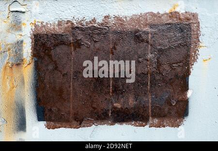 brown paint rectangle on white old dirty iron surface background, copy space Stock Photo