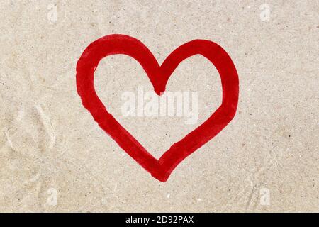 red heart watercolor painted on craft brown paper Stock Photo