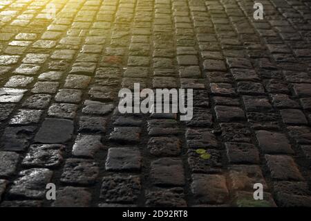 Granite paving stones on the pavement at night. Stock Photo
