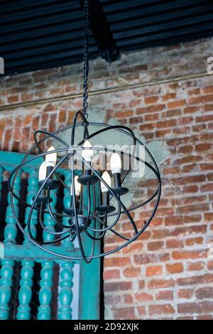 round chandelier, gold, brass, different shapes of a circles, inside lamp there are candles. Fashion design chandeliers.Old fashioned lantern.lamps Stock Photo
