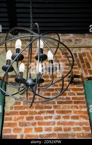 round chandelier, gold, brass, different shapes of a circles, inside lamp there are candles. Fashion design chandeliers.Old fashioned lantern.lamps Stock Photo