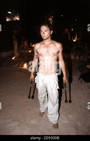 Fire poi juggling at the sunset celebrations outside Cafe Mambo in San Antonio Ibiza Balearic Islands Spain Stock Photo