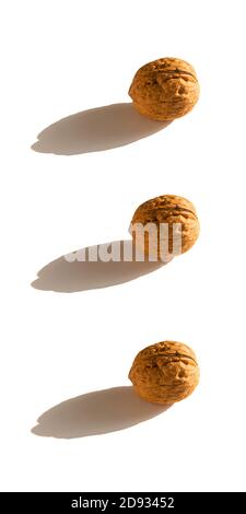 three walnuts on white background. Stock Photo