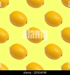 Seamless pattern with yellow lemons on yellow background Stock Photo