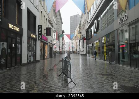 Brussels, Belgium. 2nd Nov, 2020. Closed shops are seen on a shopping street in Brussels, Belgium, Nov. 2, 2020. Starting from Nov. 2, Belgium moved to stricter lockdown, with rules valid throughout the country to fight against COVID-19. According to the rules, all non-essential businesses have to close. Food stores and supermarkets remain open. Credit: Zheng Huansong/Xinhua/Alamy Live News Stock Photo