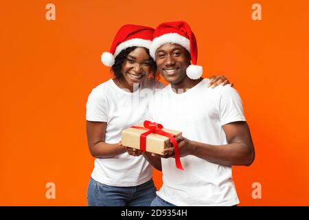 Happy black man and woman celebrating Christmas together Stock Photo