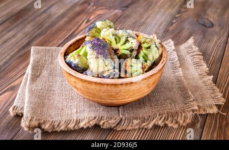 Bowl of Asian fried cauliflower on rustic background Stock Photo