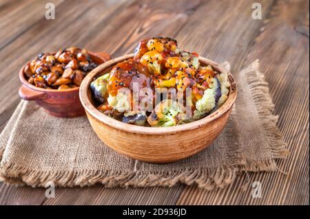 Bowl of Asian fried cauliflower with sweet chili sauce Stock Photo