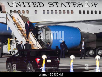 U.S. President Donald Trump deplanes Air Force One as he arrives to speak at a campaign rally at Miami-Opa Locka Executive Airport. President Trump held events in five states today, as he continues his campaign against Democratic presidential nominee Joe Biden two days before the November 3 election.