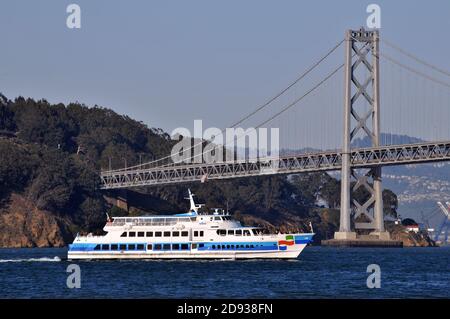 Ferry Marin passing in front of the Bay Bridge on a summer evening in San Francisco Stock Photo