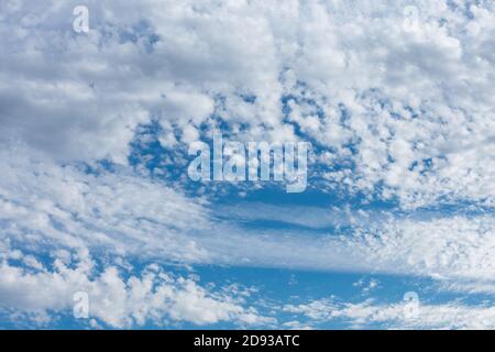 A Light Blue Sky With Whispy and Fluffy Clouds for Sky Replacement Stock Photo