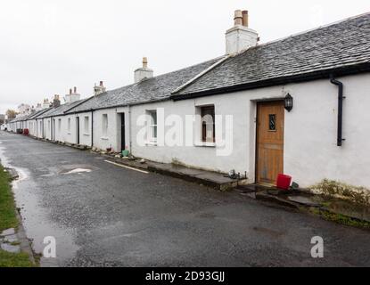 A street of white single storey cottages, Ellenabeich, Easdale, Isle of Seil, Scotland Stock Photo