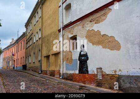 Historic buildings and cobblestone street in the old town, Vilnius, Lithuania Stock Photo