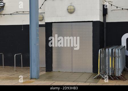 Cambridge UK, England , 02-11-2020 Night club commercial unit made secure using metal to board up doors to prevent intruders. Stock Photo