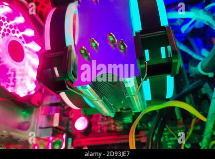 Modern computer air cooling with multi-colored led backlight-fans, cooling radiators, cables, boards, close-up, macro. Stock Photo