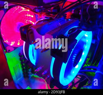 Modern computer air cooling with multi-colored led backlight-fans, cooling radiators, cables, boards, close-up, macro. Stock Photo