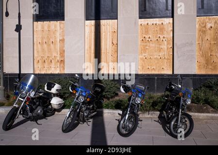 Washington DC, USA, 2nd Nov, 2020. DC Metropolital Police motorcycles parked in front of a boarded building. A day before 59th election. Law enforcement are preparing for possible election outcome riots on Nov 3rd. Washington DC, USA. Yuriy Zahvoyskyy/ Alamy Live News. Stock Photo