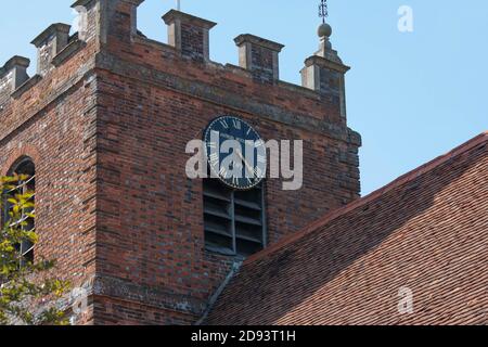 Clock tower of St James the Less, Pangbourne.  Kenneth Grahame the author of Wind in the Willows, lived in the adjacent Church Cottage. Stock Photo