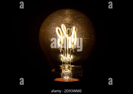 Sylvania ToLEDo retro filament style modern LED lamp for 240V circuits. Lamp is a modern take on the early loop filament designs Stock Photo