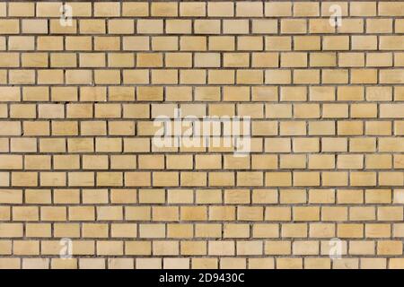 Surface of a yellow brick wall. Stock Photo