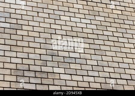 Surface of a yellow brick wall. Stock Photo