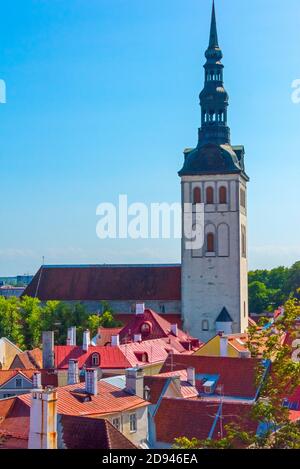 St. Nicholas' Church with historical buildings with red roof in the old town, Tallinn, Estonia Stock Photo