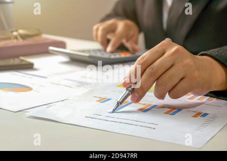 Businessmen are reviewing reports, financial documents for financial data analysis, work ideas and market data. Stock Photo