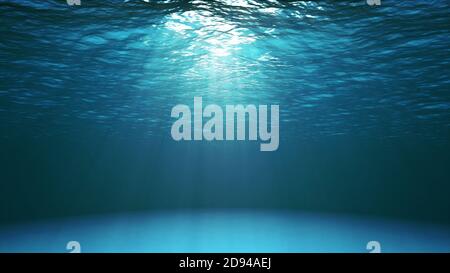 Dark blue ocean surface seen from underwater. Abstract Fractal waves underwater and rays of sunlight shining through Stock Photo