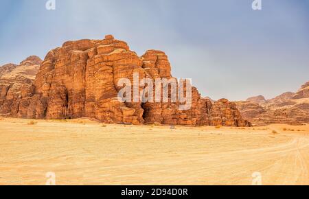 Exploring the rugged Wadi Rum desert in a four wheel drive vehicle Stock Photo