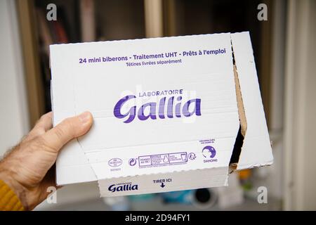 Paris, France - Oct 27, 2020: POV male hand holding new Gallia infant formula for babies Premium Galliagest package Stock Photo