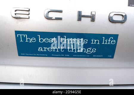 Sign on the back of a car 'best things in life aren't things'. St Paul Minnesota MN USA Stock Photo