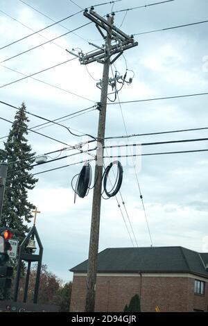 Complex set of wiring on a telephone pole. Lindstrom Minnesota MN USA Stock Photo