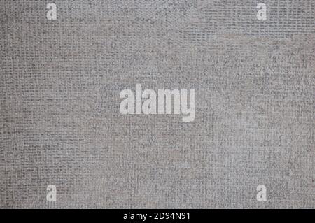 A fragment of a side of a dark gray fabric with a braided pattern. Background, texture. Stock Photo