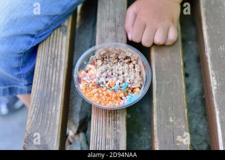 Premium Photo  Melting chocolate melts in a candy melting pot to prepare  gourmet mini chocolates with sprinkles