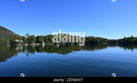 Lake Santeetlah, North Carolina - October, 2020 - Lake homes on lakeshore in autumn. Stock Photo