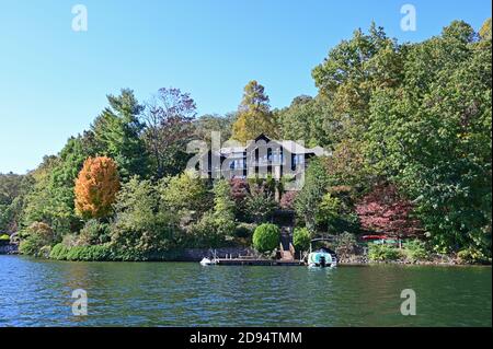 Lake Santeetlah, North Carolina - October, 2020 - Lake homes on lakeshore in autumn. Stock Photo